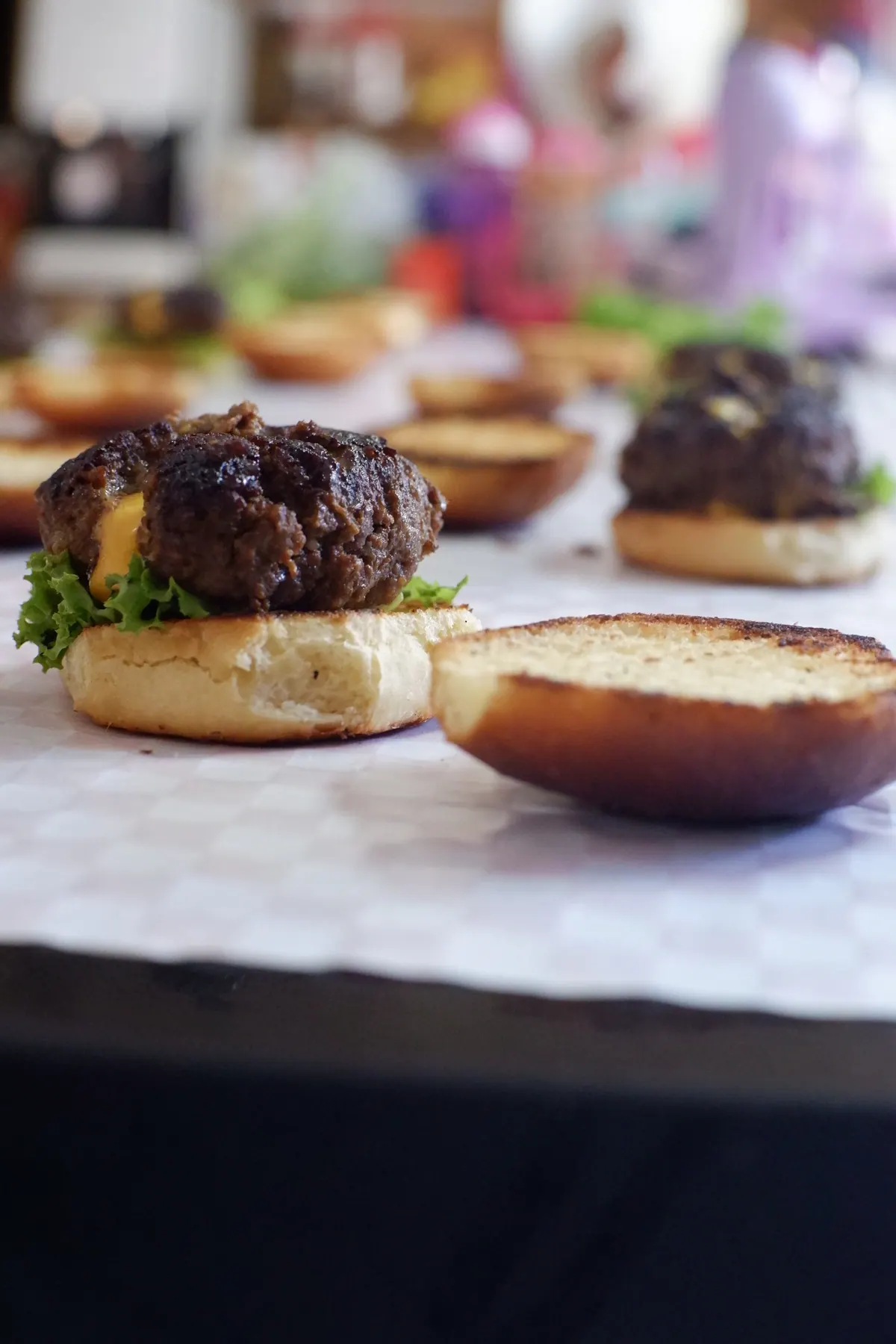 An open-faced Byrdhouse burger on the pass, more behind it